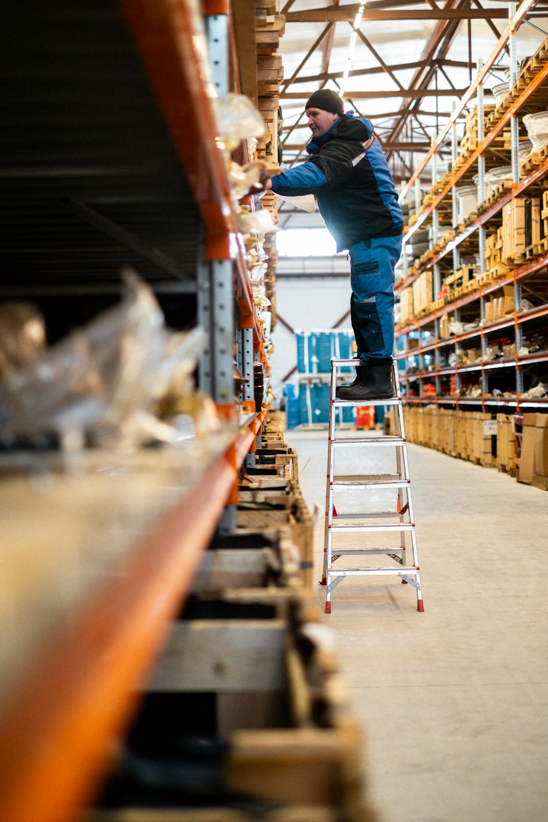 Warehouse worker checking inventory before distribution