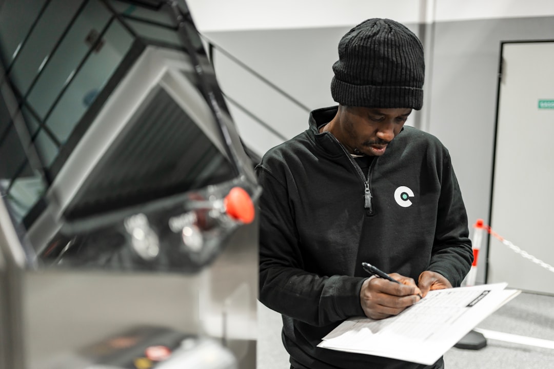 Technician completing an industrial quality check sheet