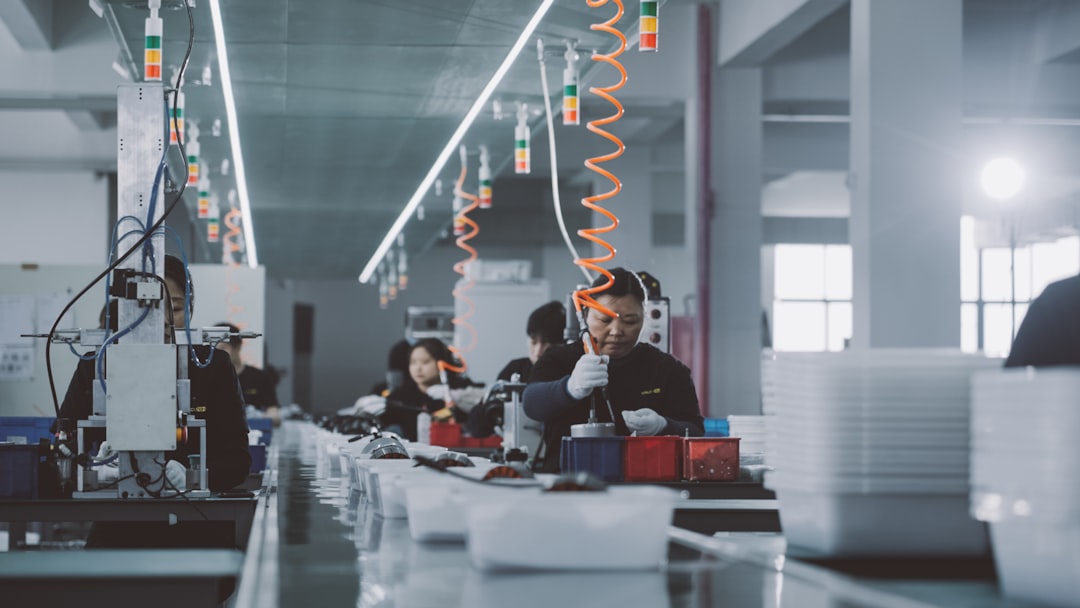 Factory team reviewing product quality before production